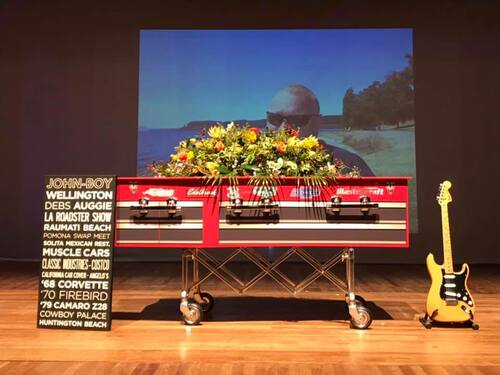Red Coffin at funeral with flowers