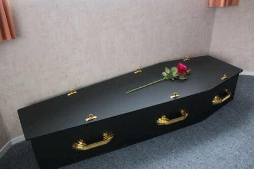 Elegant Black Coffin with Gold Hardware